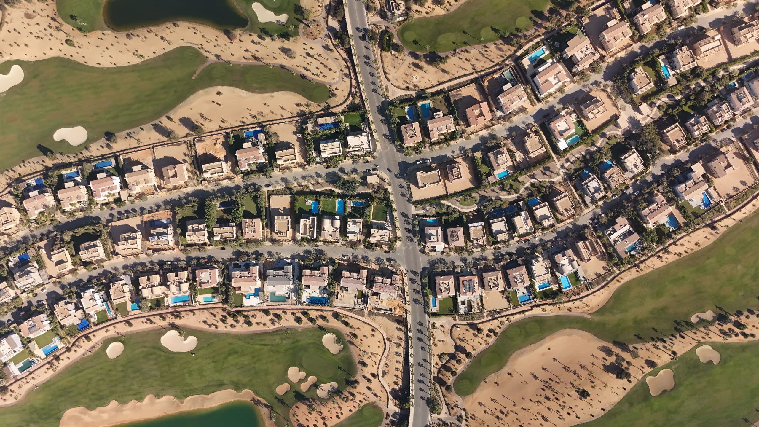 Aerial view of a Dubai villa community, individual plots clearly bounded
