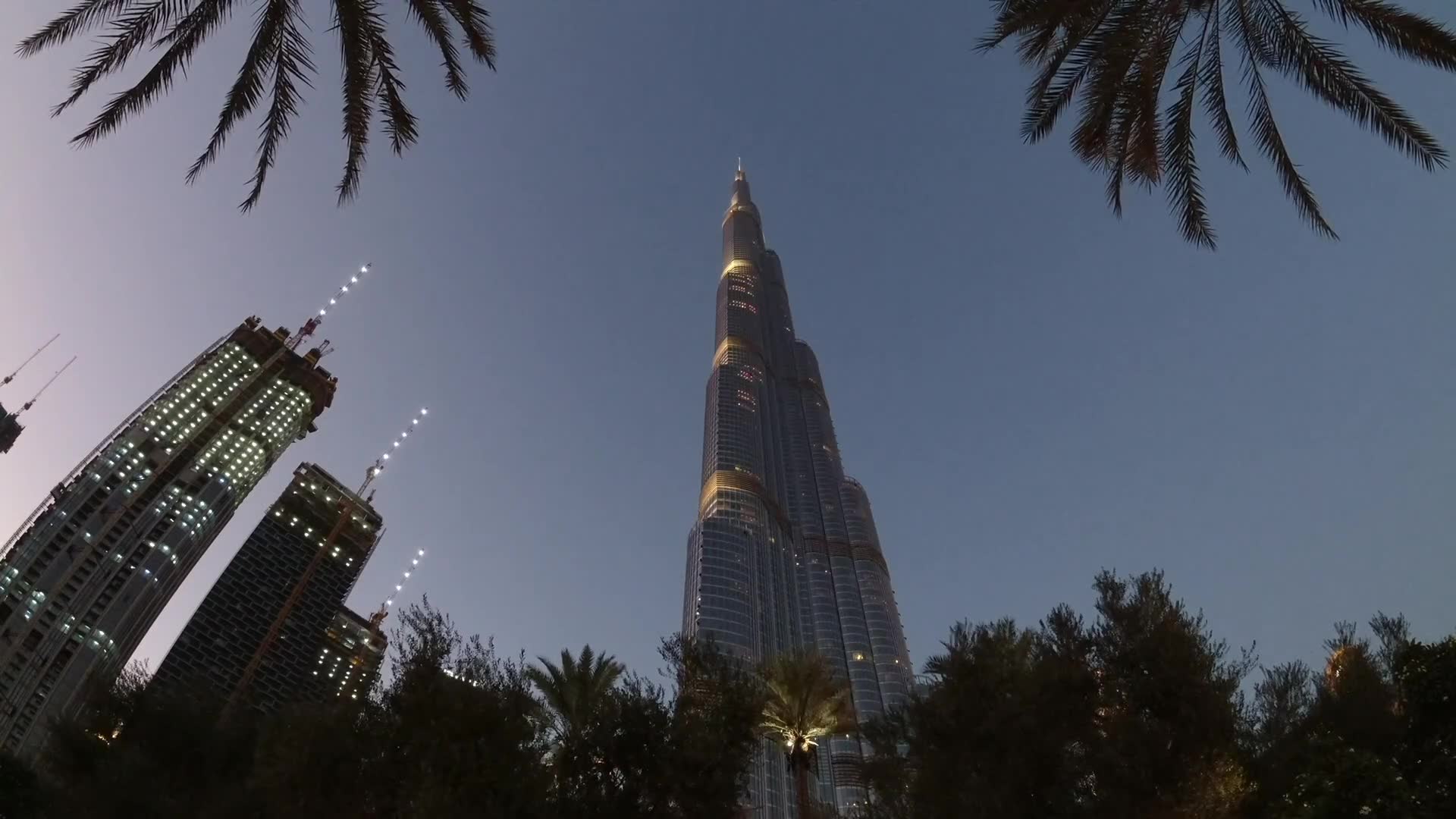 The Burj Khalifa lit at dusk, seen from Downtown Dubai
